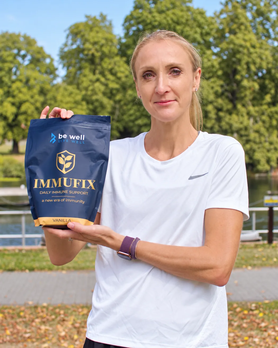 Paula Radcliffe holding a pouch of Immufix Vanilla